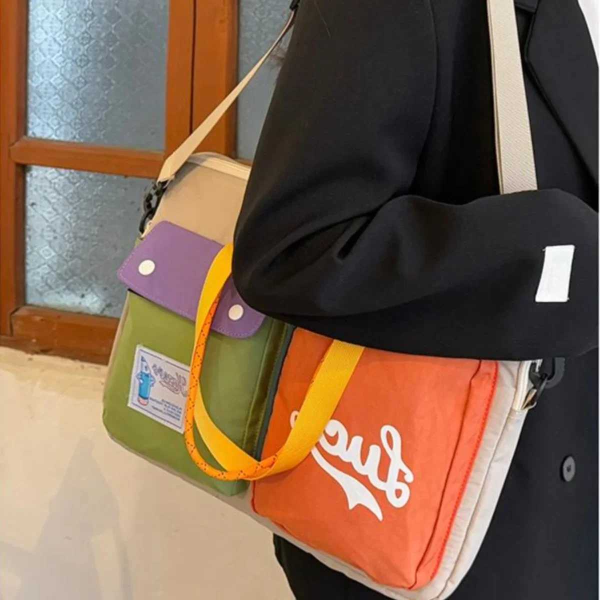 Womens niche color blocked cartoon pattern computer bag portable one shoulder handbag university style daily commuting bag