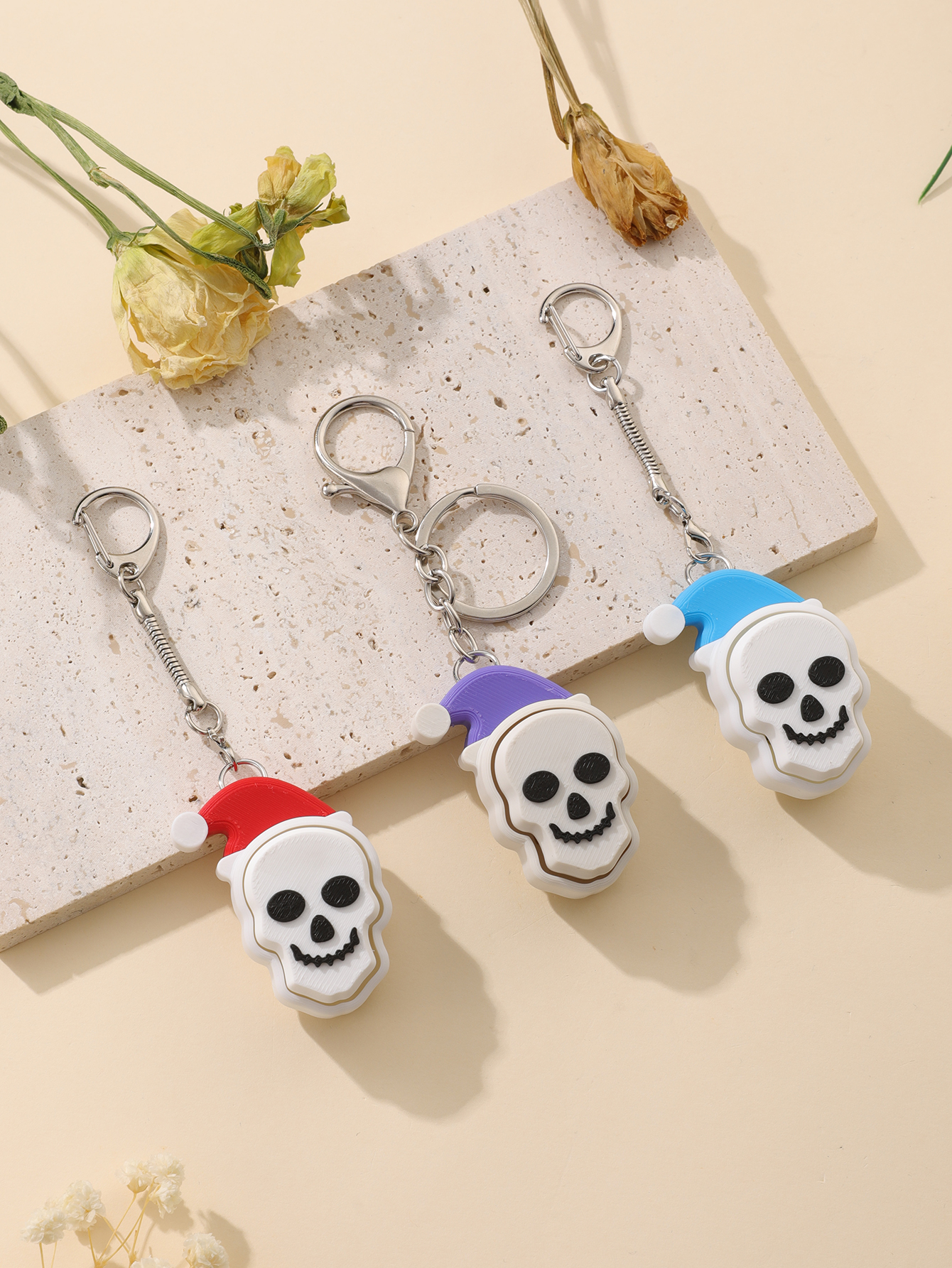 Porte-clés de crâne de chapeau de Noël imprimé en 3D - jouet de soulagement du stress pour adultes, avec un gadget portable de relief d'anxiété a