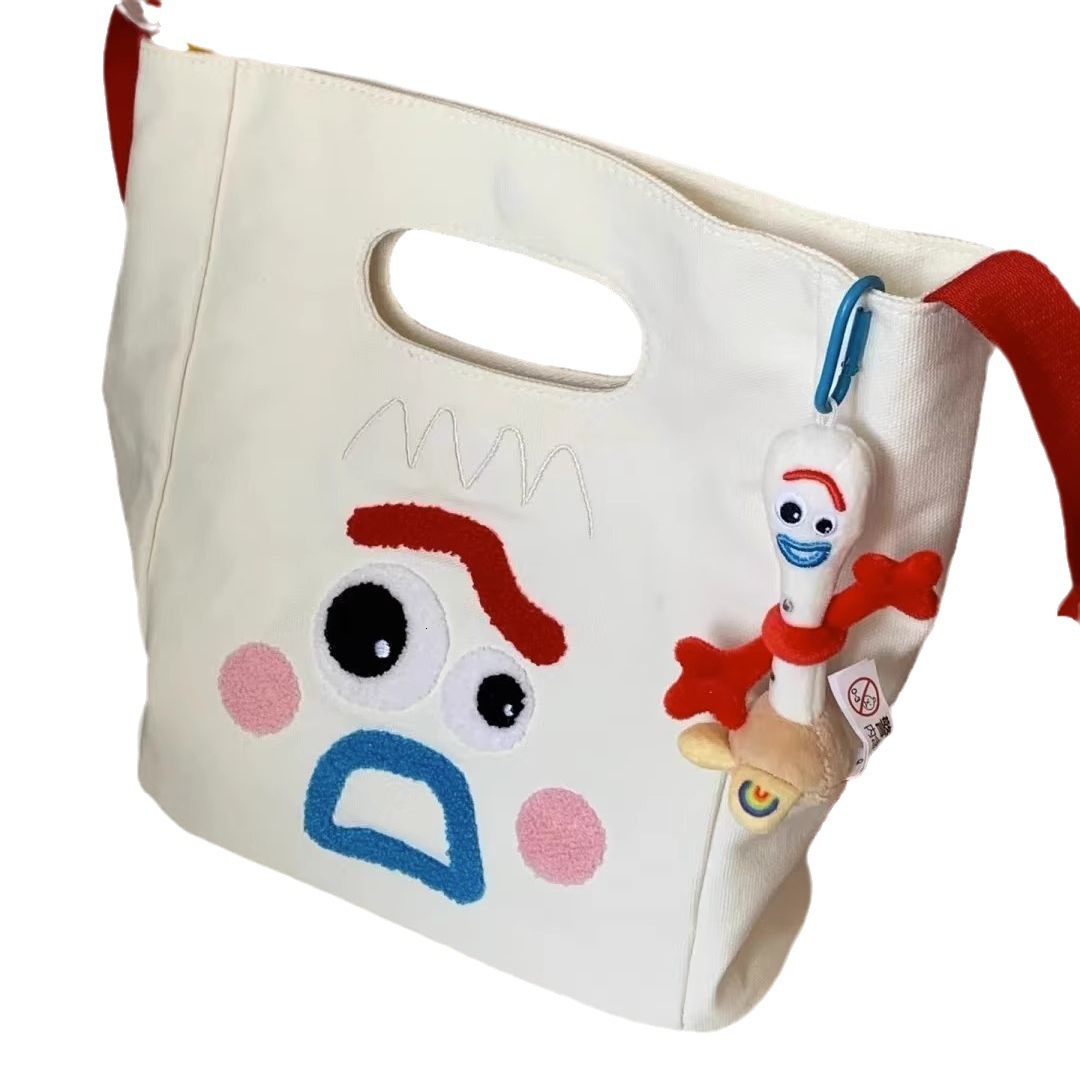 designer 2023 New Funny Expression Canvas Bag Women's Bag Large Capacity Handbag Ins Cute Casual Shoulder Crossbody Bag