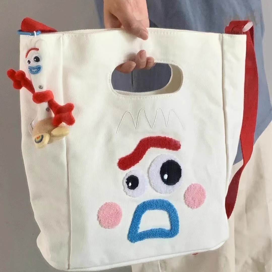 designer 2023 New Funny Expression Canvas Bag Women's Bag Large Capacity Handbag Ins Cute Casual Shoulder Crossbody Bag