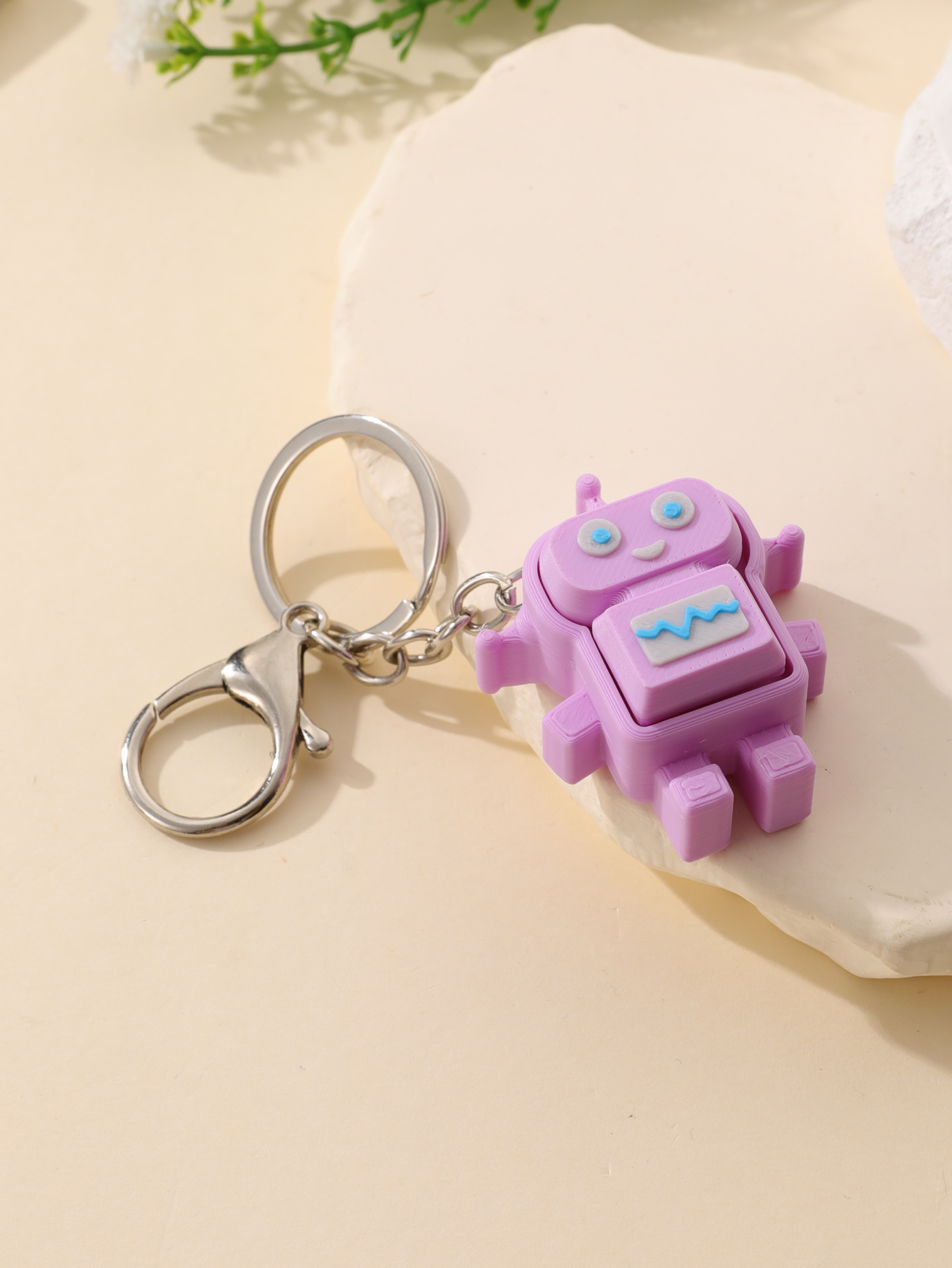 3D printed robot keychain - an adult stress relief toy with a portable anxiety-reducing gadget featuring a clickable keyboard design