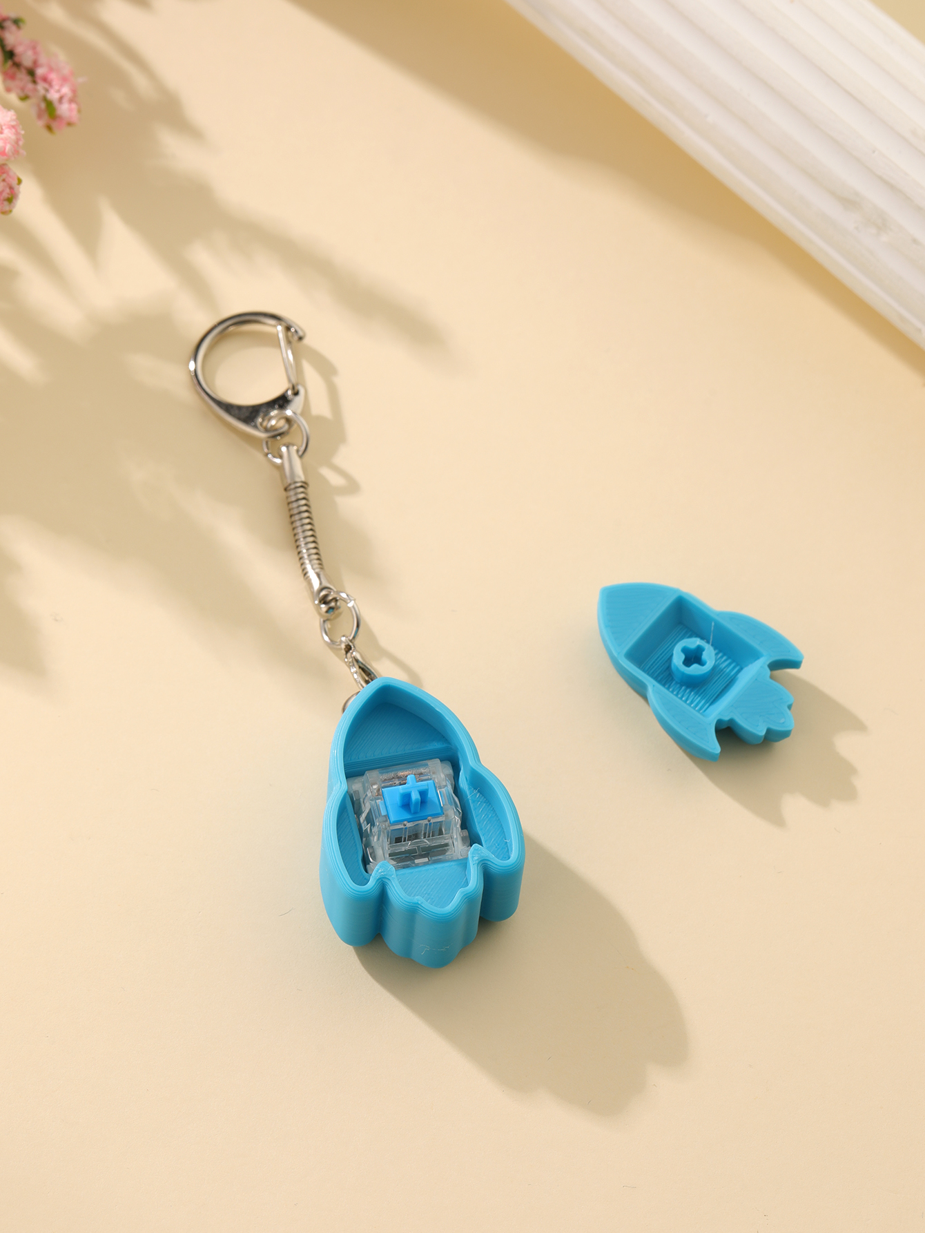 3D printed rocket keychain - an adult stress relief toy with a portable anxiety-reducing gadget featuring a clickable keyboard design