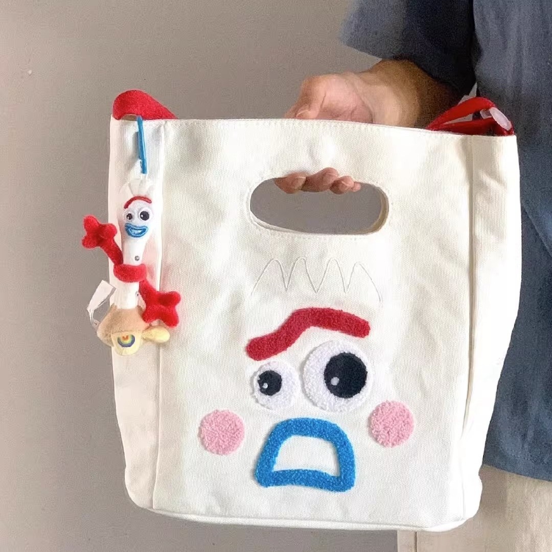 designer 2023 New Funny Expression Canvas Bag Women's Bag Large Capacity Handbag Ins Cute Casual Shoulder Crossbody Bag