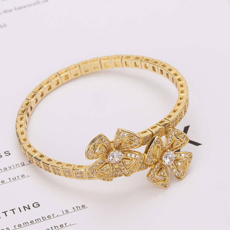 DHcollections New Eternal Petal Bracelet with Zircon Inlay Fashionable Modern Jewelry for Women Spring Snake Bone Hollow Double Flower Accessories