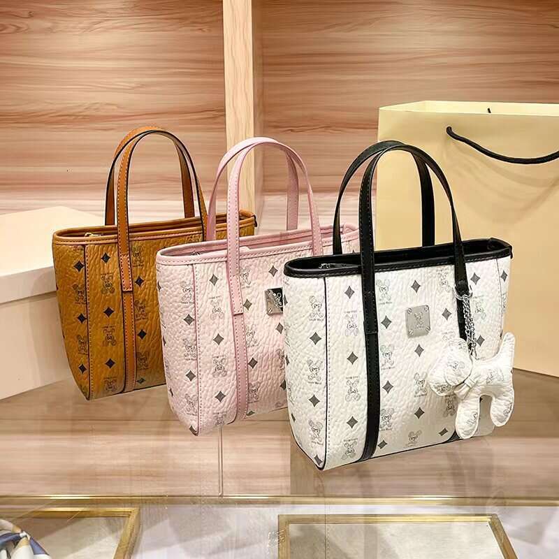 2025 New Women's Tote with Printed Fashion Texture, High-end Feel, Suitable for Middle-aged Women, Handheld, Shoulder, and Crossbody Small Bag Tr