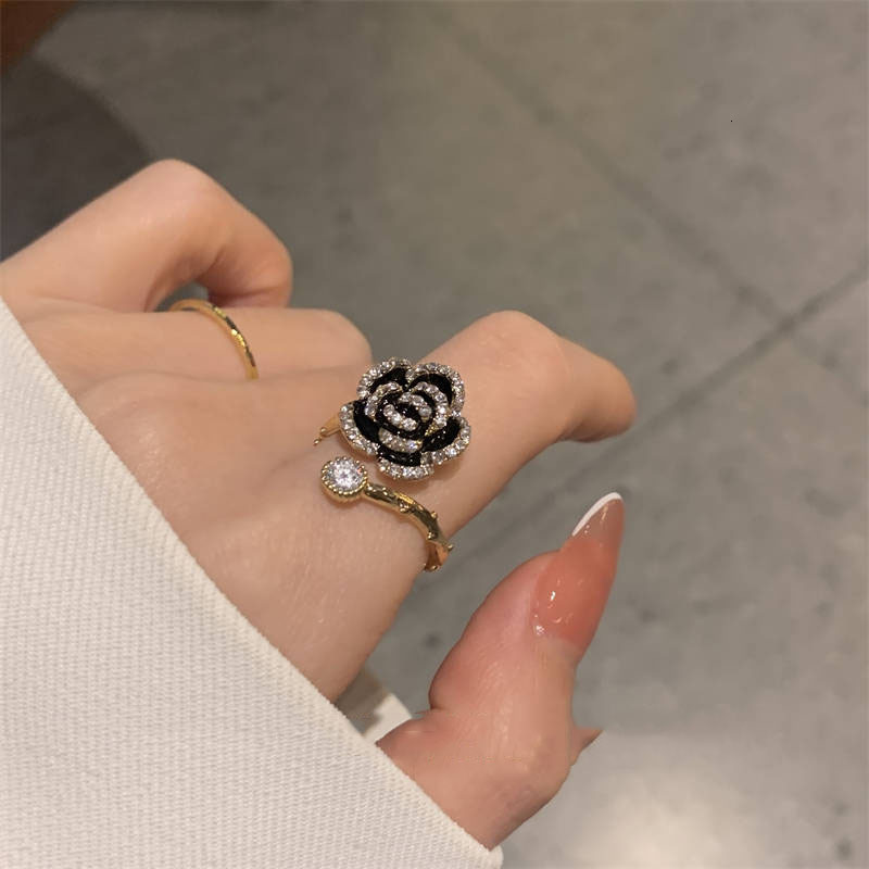 South Korea Dongdaemun Black Camellia Micro Pave Zircon Open Ring for Women High-end Light Gentle Temperament Ring 250710