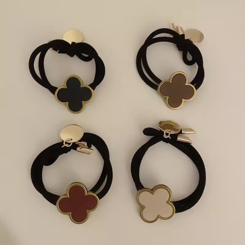 Korean Four-Leaf Clover High-End Hair Tie for Women Summer Non-Tightening Simple Elegant Ponytail Hair Band Black Leather Cover 250711