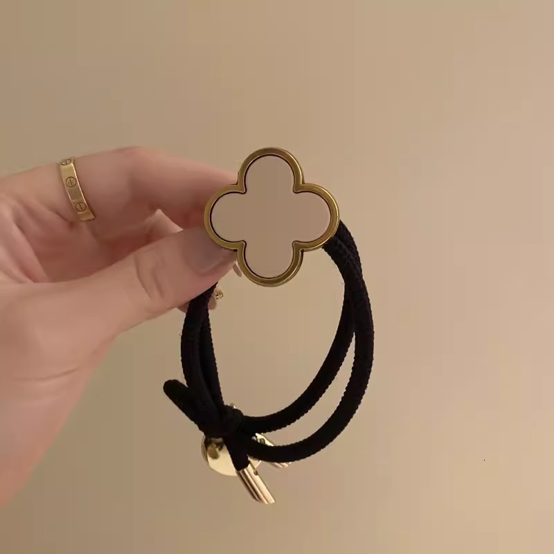 Korean Four-Leaf Clover High-End Hair Tie for Women Summer Non-Tightening Simple Elegant Ponytail Hair Band Black Leather Cover 250711