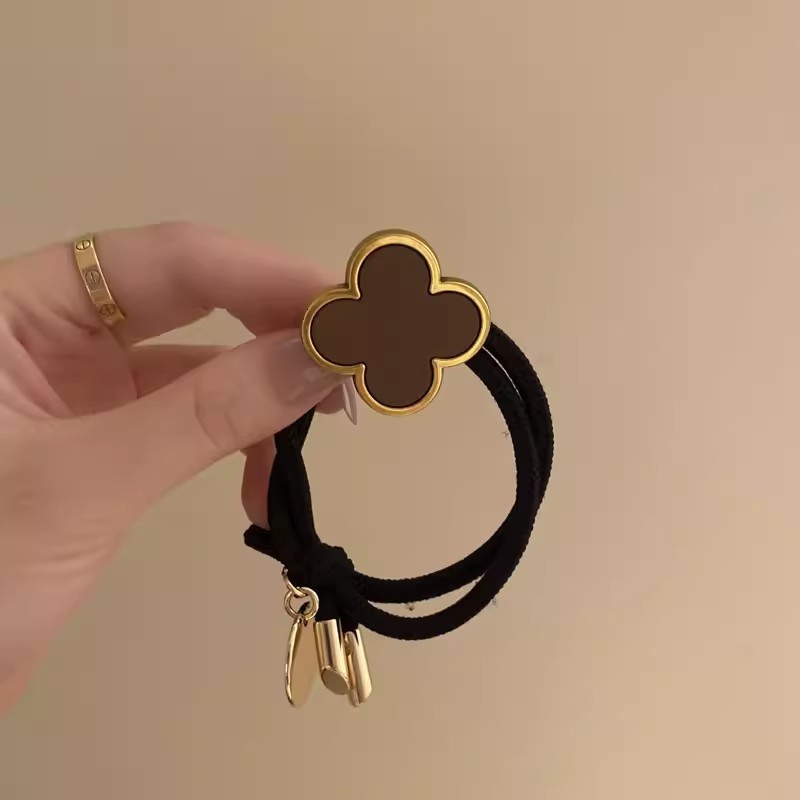 Korean Four-Leaf Clover High-End Hair Tie for Women Summer Non-Tightening Simple Elegant Ponytail Hair Band Black Leather Cover 250711