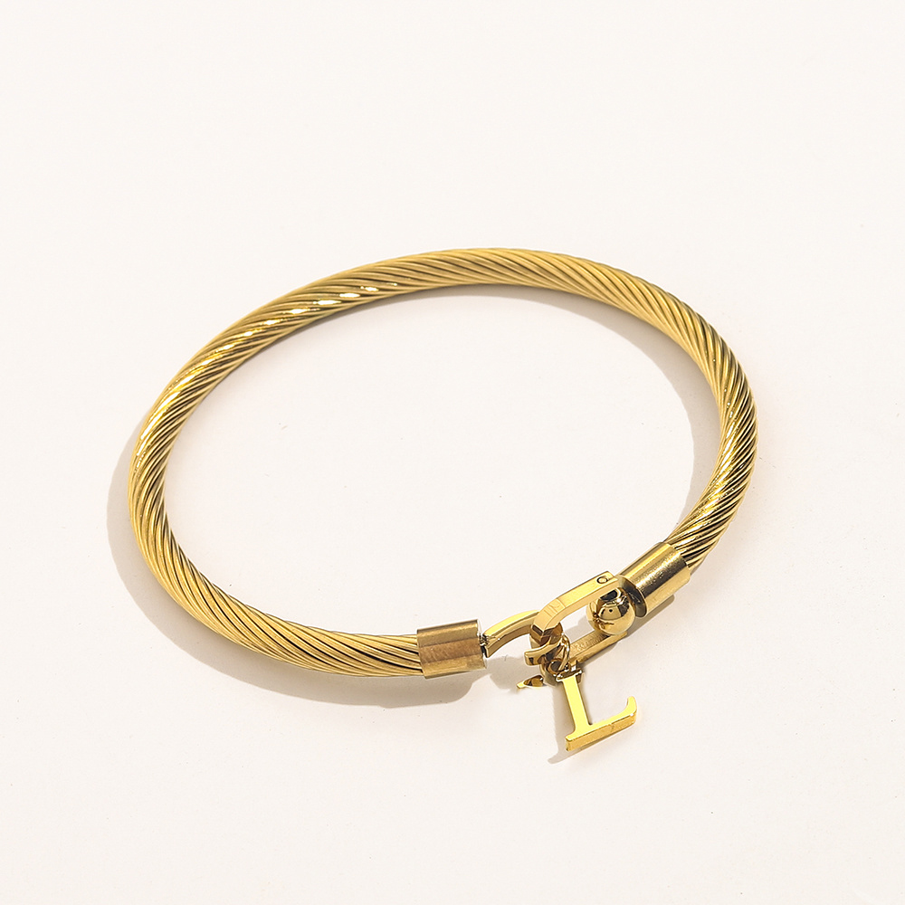 Silver Wire-Wrapped Bangle Bracelet With Letter Charm And Secure Clasp Elegant Minimalist Jewelry And Thoughtful Gift For Her Modern Everyday Design