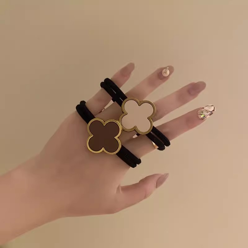 Korean Four-Leaf Clover High-End Hair Tie for Women Summer Non-Tightening Simple Elegant Ponytail Hair Band Black Leather Cover 250711