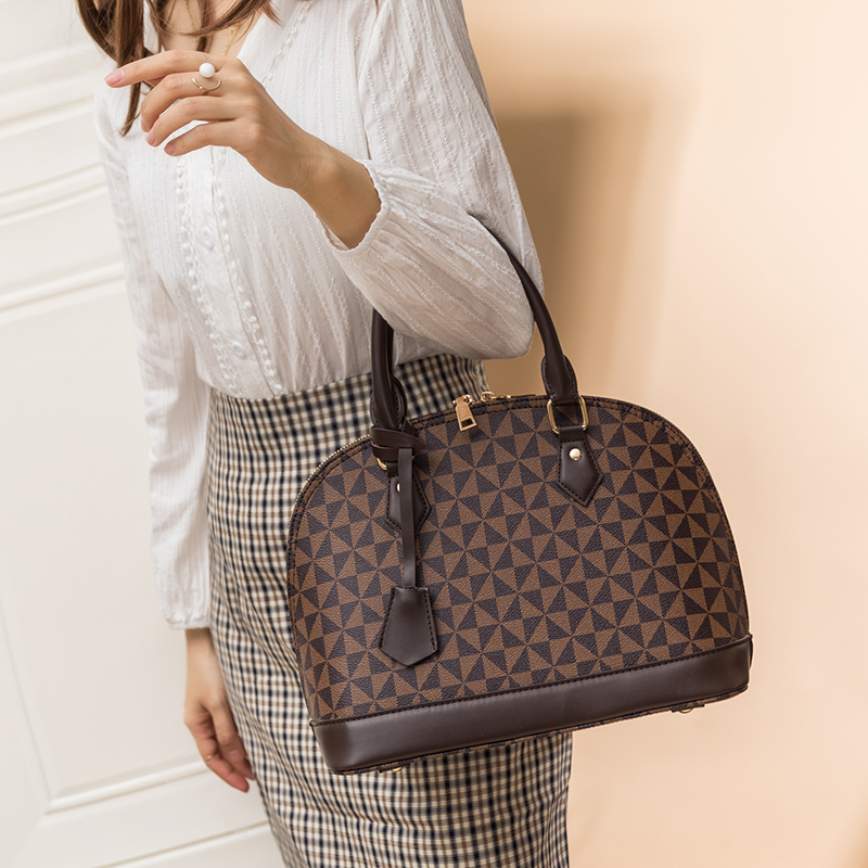 2025 new free shipping designer Geometric Patterned Dome Shaped Handbags with Top Handles Elegant and Fashionable for Daily Use