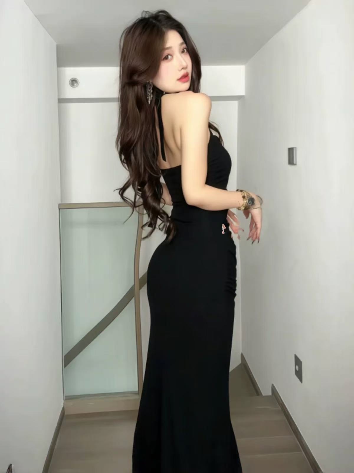 Black sexy open-necked dress for women in summer, tight-fitting and edgy design with a waistline, long skirt
