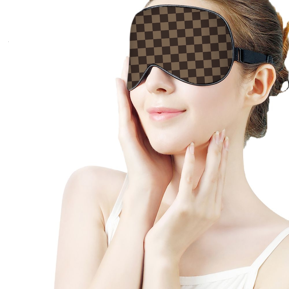 ddmythur brown eye mask with a checkered pattern