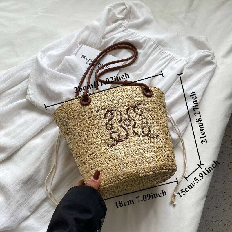 Niche weaving underarm small female 2025 summer new hundreds of beach straw bag fashion texture single shoulder bucket bags