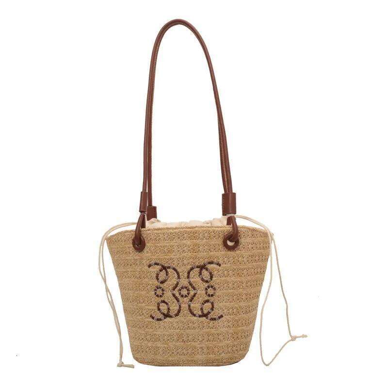 Niche weaving underarm small female 2025 summer new hundreds of beach straw bag fashion texture single shoulder bucket bags