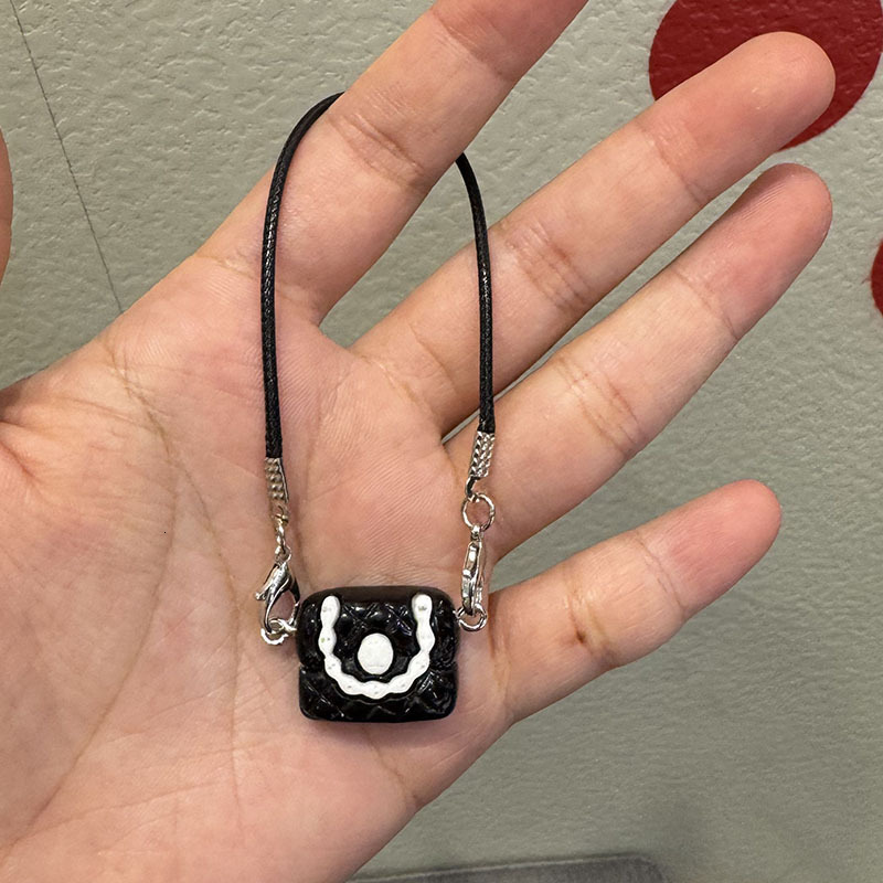 2025 New Women's Designer Cartoon Dollhouse Mini Camellia Black And White Bag Necklace Accessories Doll Pendant Accessories Handbag Accessories