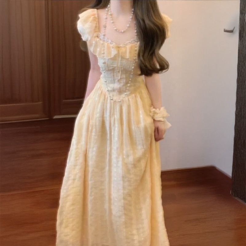 Summer New Women's Skirt Soft Yellow Square Neck Fluffy Sleeve Waist Strap Women's French Sweet Sweet Dress Niche Princess Dress New Luxury 