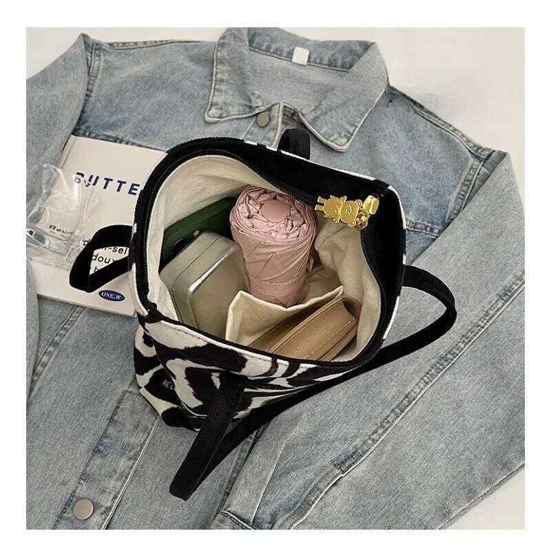 Women's Casual Hand Bucket 2025 Autumn And Winter Striped Simple Kitten Canvas Shoulder Bag