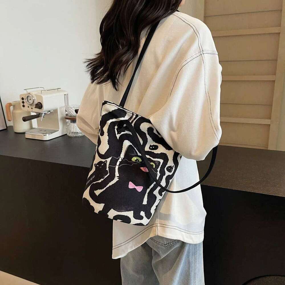 Women's Casual Hand Bucket 2025 Autumn And Winter Striped Simple Kitten Canvas Shoulder Bag