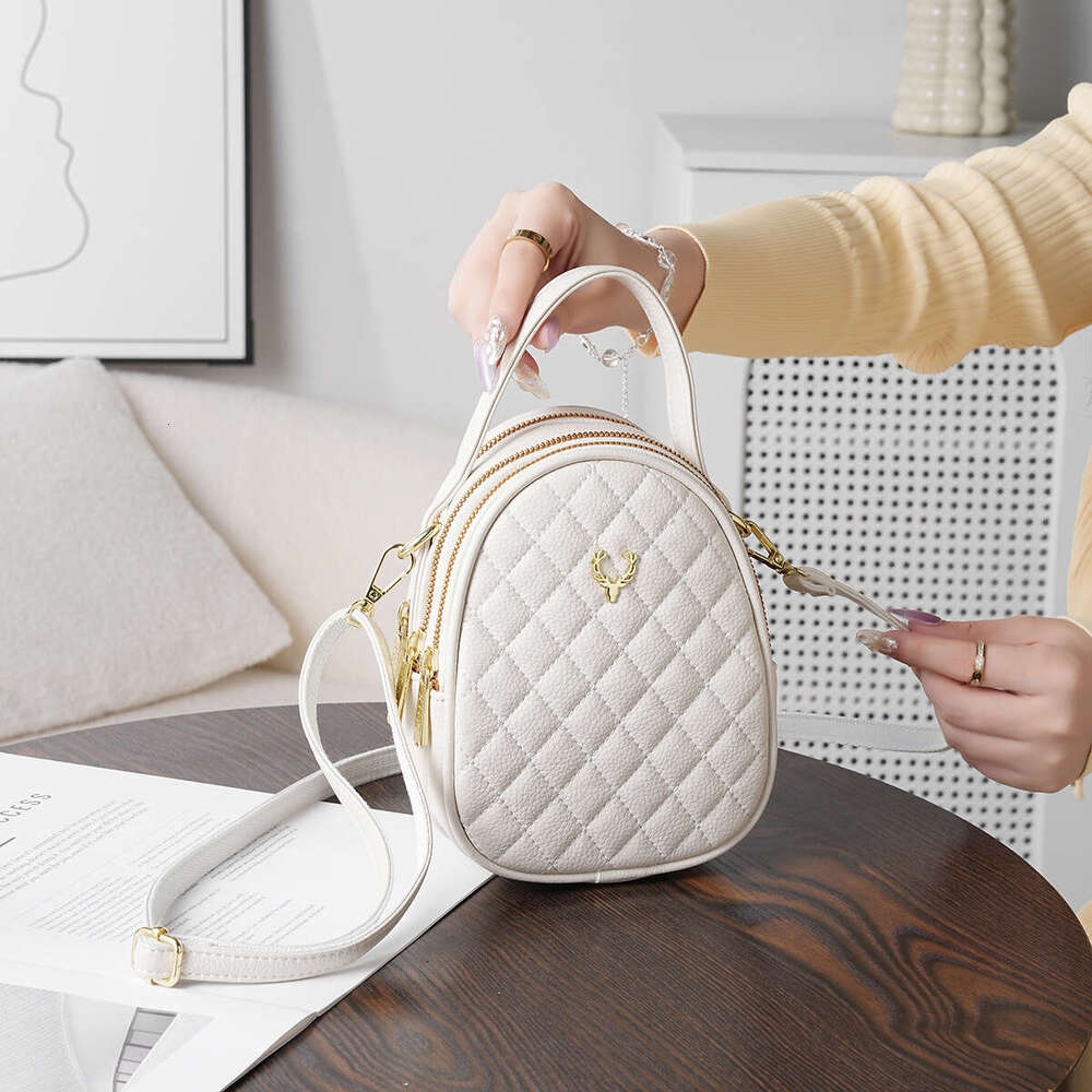 Quilted Leather Crossbody Phone Bag with Charm Stylish Compact Shoulder Purse for Travel Daily Use Lightweight and Durable Handheld Design