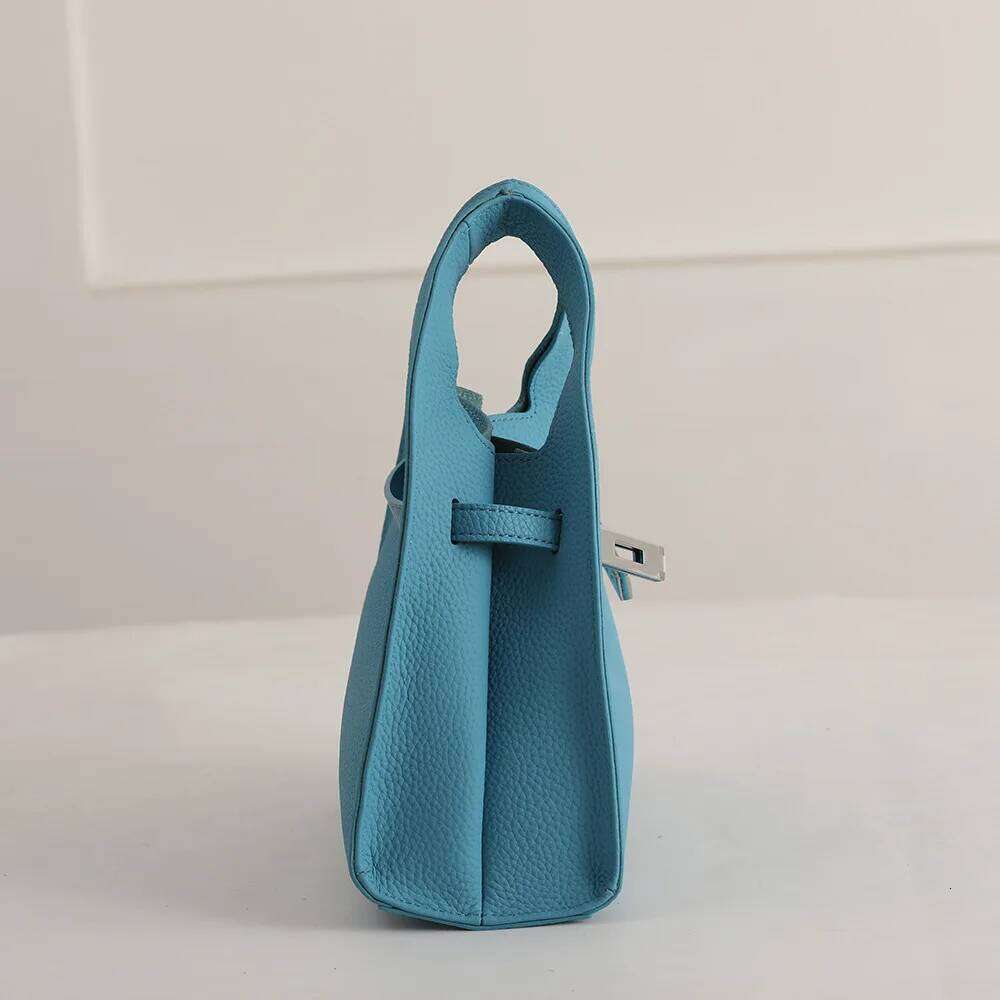 Genuine leather basket handbag 2025 new niche design top layer cowhide garbage women's one-shoulder crossbody bag