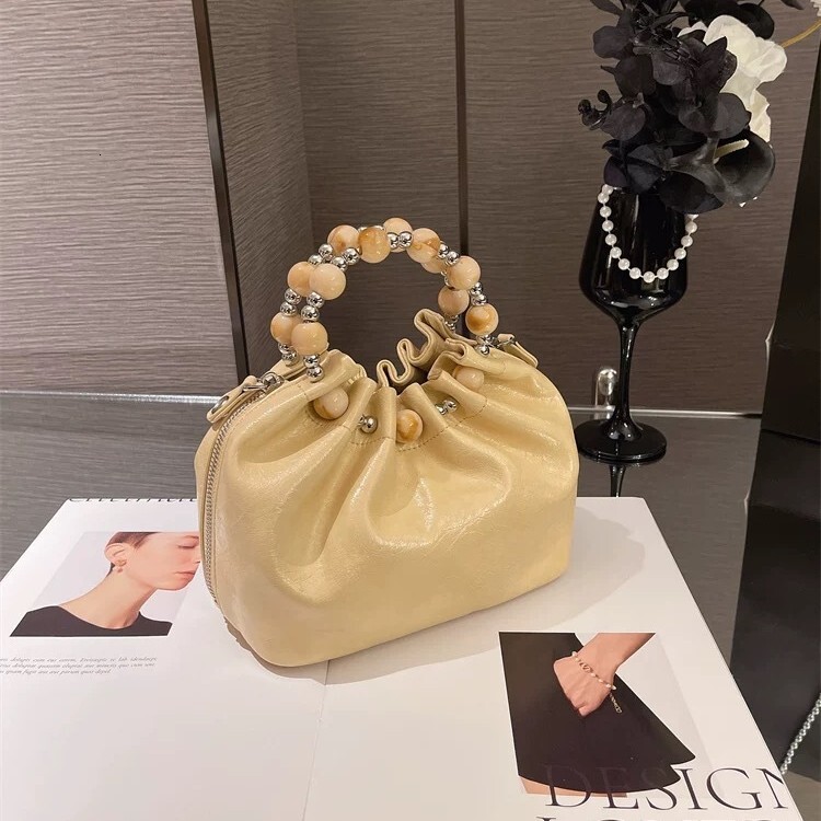 Luxury Women's New Chain Shoulder Crossbody Bag Free Shipping Designer Fashion Bead Carrying Cloud Bag Versatile Casual Shopping Bag