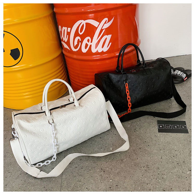 2025 Small - distance travel bag, large - capacity PU hand - carried business travel luggage bag fashionable embossed sports and fitness bag