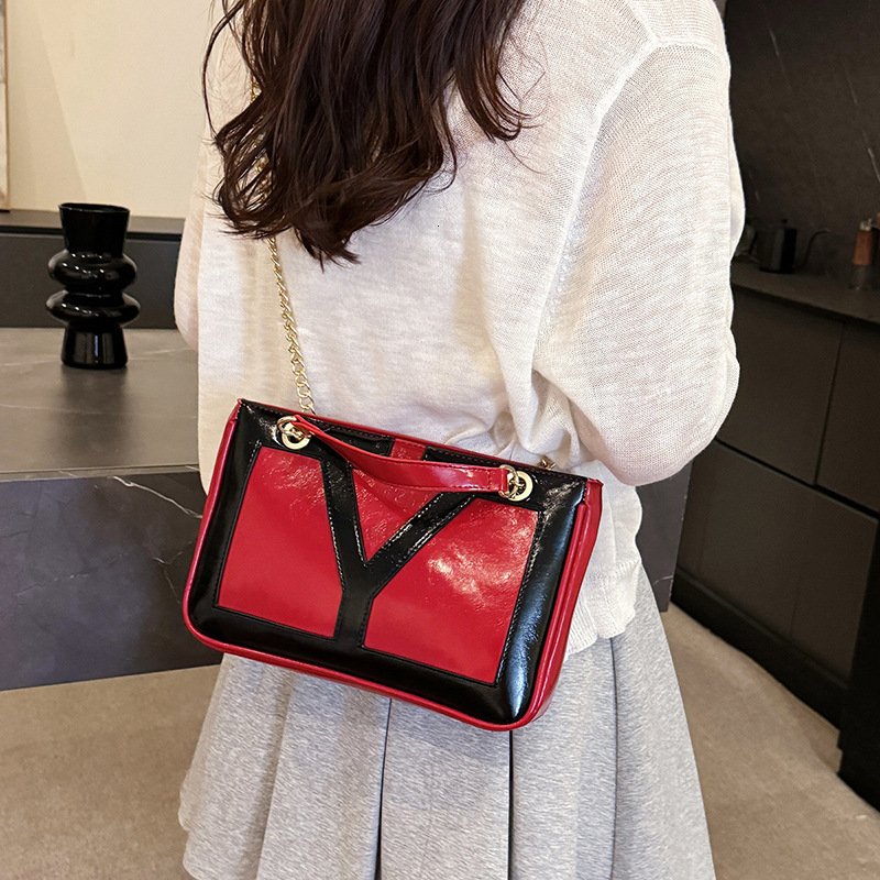 Free shipping designer bag 2025 New fashion patchwork Underarm Bag Women Temperament Commuter Bag casual Shoulder Bag PU Texture Chain Crossbody Bag