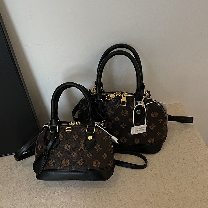 Light luxury Fashionable female Advanced printed retro light luxury hand-held vintage flower shell bag new versatile and temperament crossbody bag sho