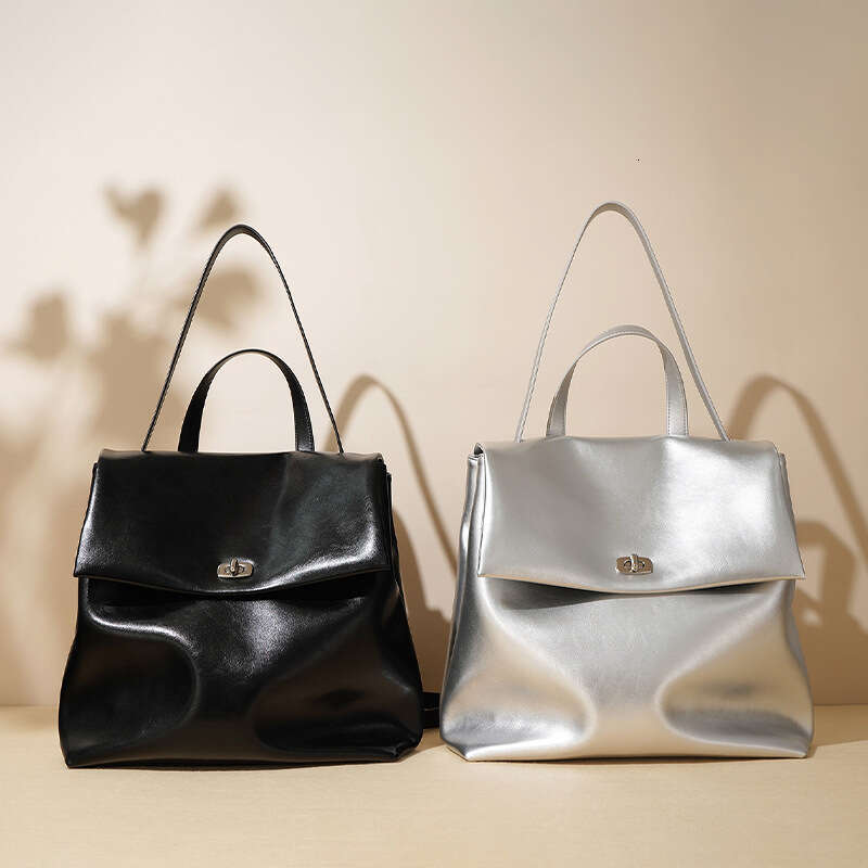 Luxury designer autumn new INS ladies silver Korean version of leather niche fashion trend campus wind backpack