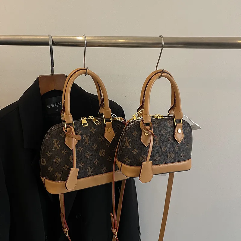 Light luxury Fashionable female Advanced printed retro light luxury hand-held vintage flower shell bag new versatile and temperament crossbody bag sho