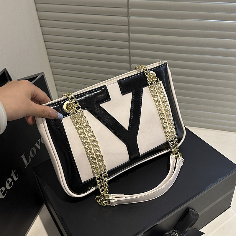 Free shipping designer bag 2025 New fashion patchwork Underarm Bag Women Temperament Commuter Bag casual Shoulder Bag PU Texture Chain Crossbody Bag