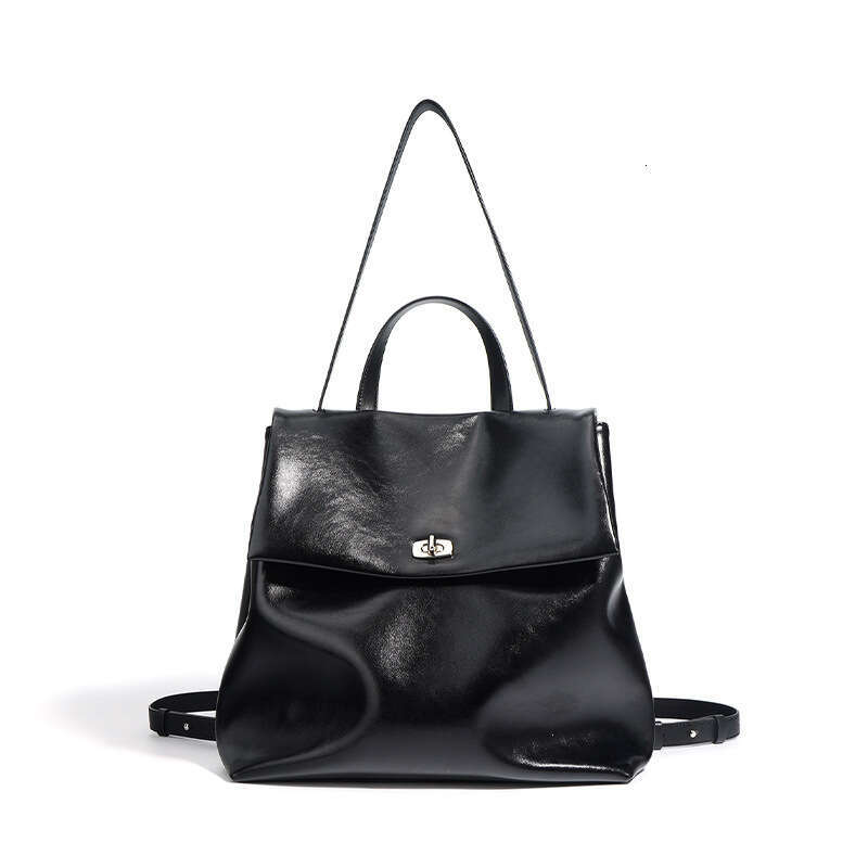 Luxury designer autumn new INS ladies silver Korean version of leather niche fashion trend campus wind backpack