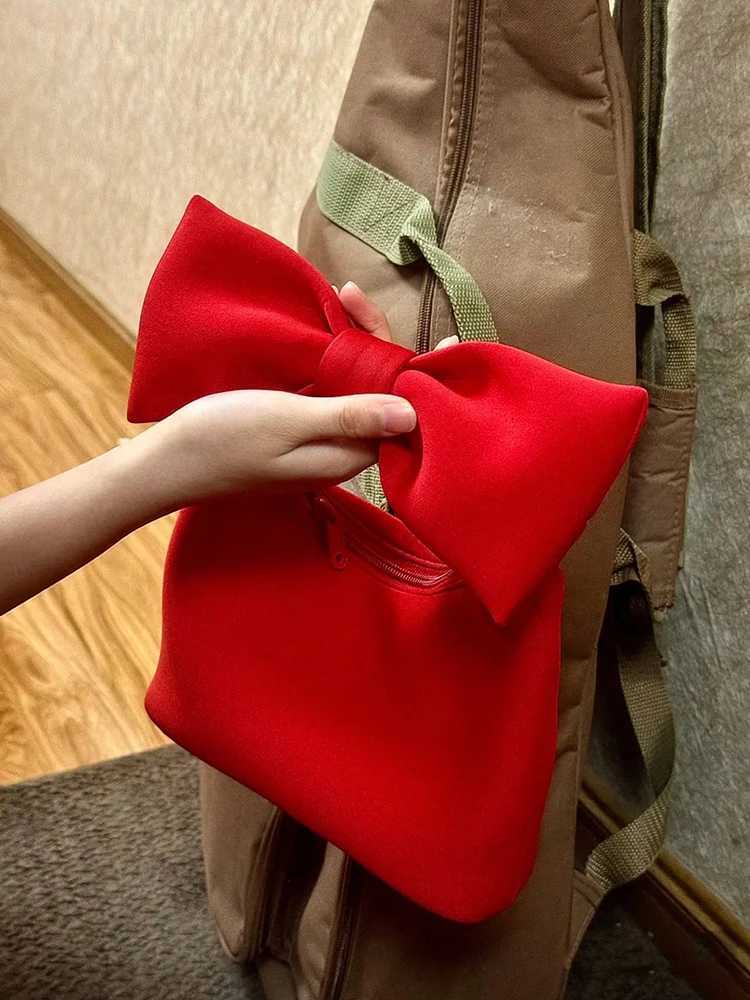 2025 new cute mini bow handbag fashionable and casual daily commuting womens bag cloud bag suitable for daily use Z250718
