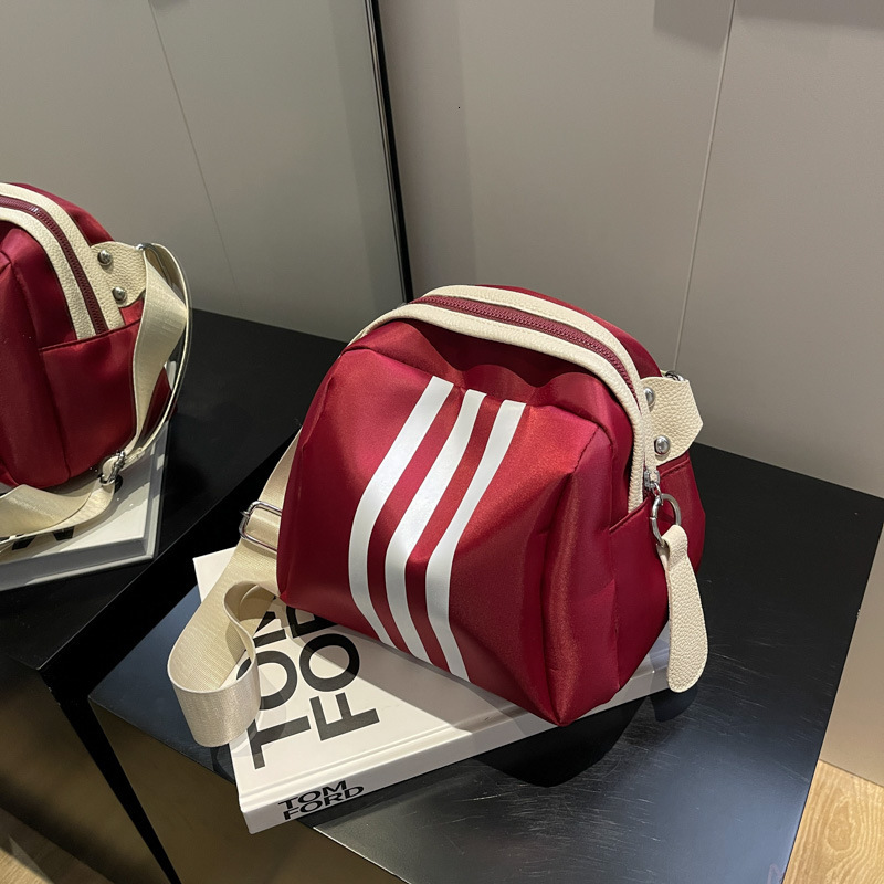 2025 summer women's new women's shoulder crossbody bag new striped shell bag summer new casual large capacity new designer bag