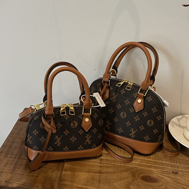 Light luxury Fashionable female Advanced printed retro light luxury hand-held vintage flower shell bag new versatile and temperament crossbody bag sho