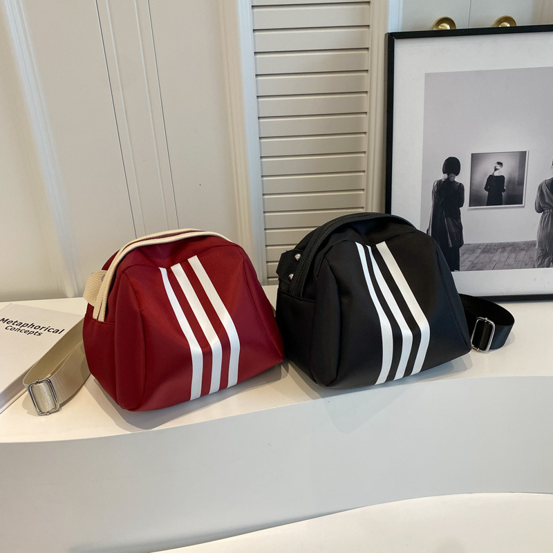 2025 summer women's new women's shoulder crossbody bag new striped shell bag summer new casual large capacity new designer bag