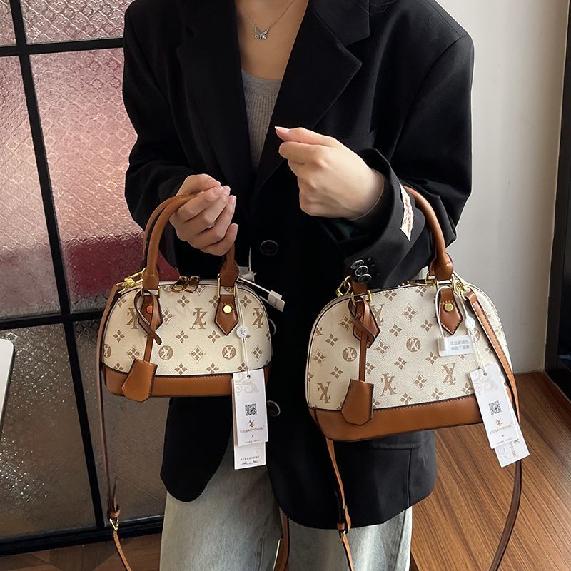 Light luxury Fashionable female Advanced printed retro light luxury hand-held vintage flower shell bag new versatile and temperament crossbody bag sho