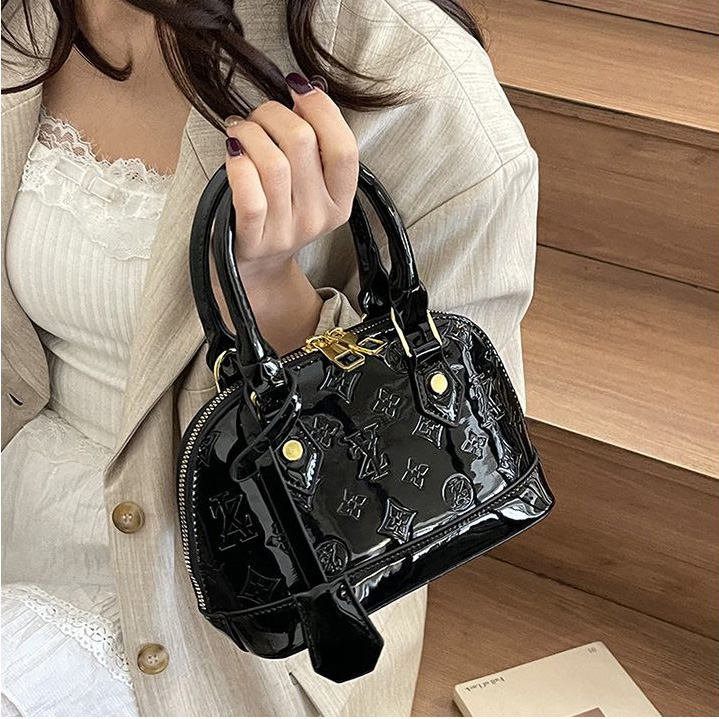 Light luxury Fashionable female Advanced printed retro light luxury hand-held vintage flower shell bag new versatile and temperament crossbody bag sho