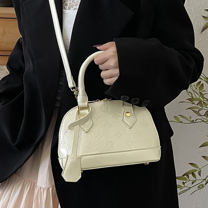 Light luxury Fashionable female Advanced printed retro light luxury hand-held vintage flower shell bag new versatile and temperament crossbody bag sho