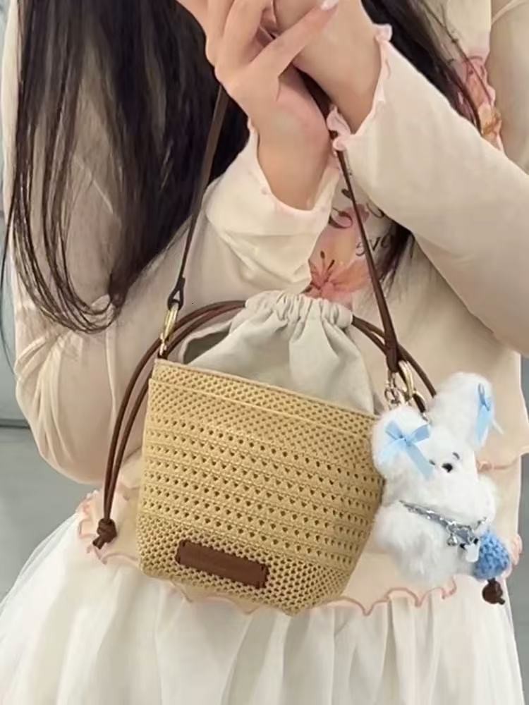 2025 Summer new women's shoulder crossbody bag new women's hollow woven bag luxurious style niche vacation beach bag brand new designer bag