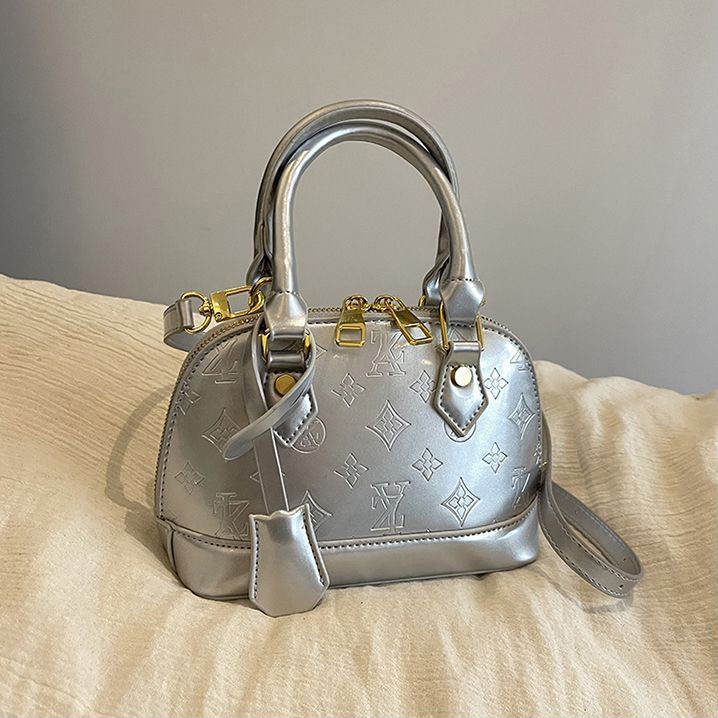 Light luxury Fashionable female Advanced printed retro light luxury hand-held vintage flower shell bag new versatile and temperament crossbody bag sho