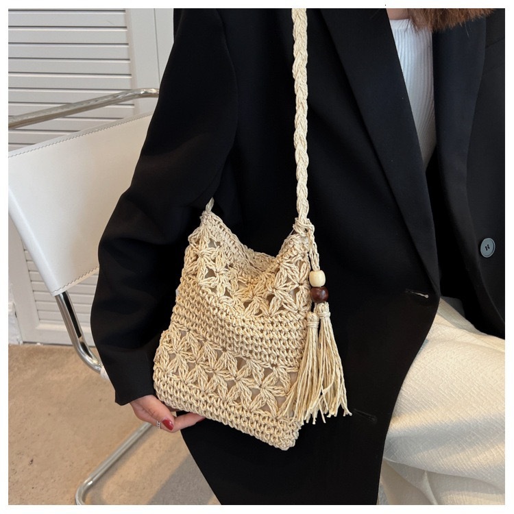 2025 Summer new women's shoulder crossbody bag tassel phone bag hollowed out tassel handmade woven bag grass bag beach shoulder bag new designer 