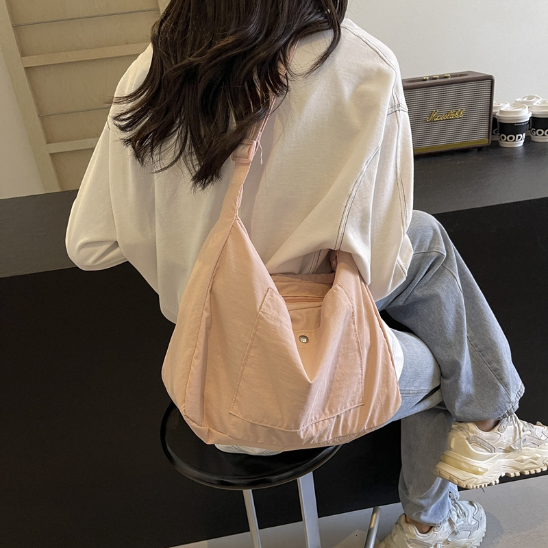 2025 Designer Leisure Multi functional Commuter Shoulder Bag Spring/Summer New Multi functional Simple Solid Color Large Capacity Crossbody Bag