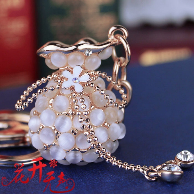 Money Bag Cat's Eye Stone Tassel Rhinestone Version Korean Women's Creative Crystal Car Keychain Key Ring Hanging Car accessories
