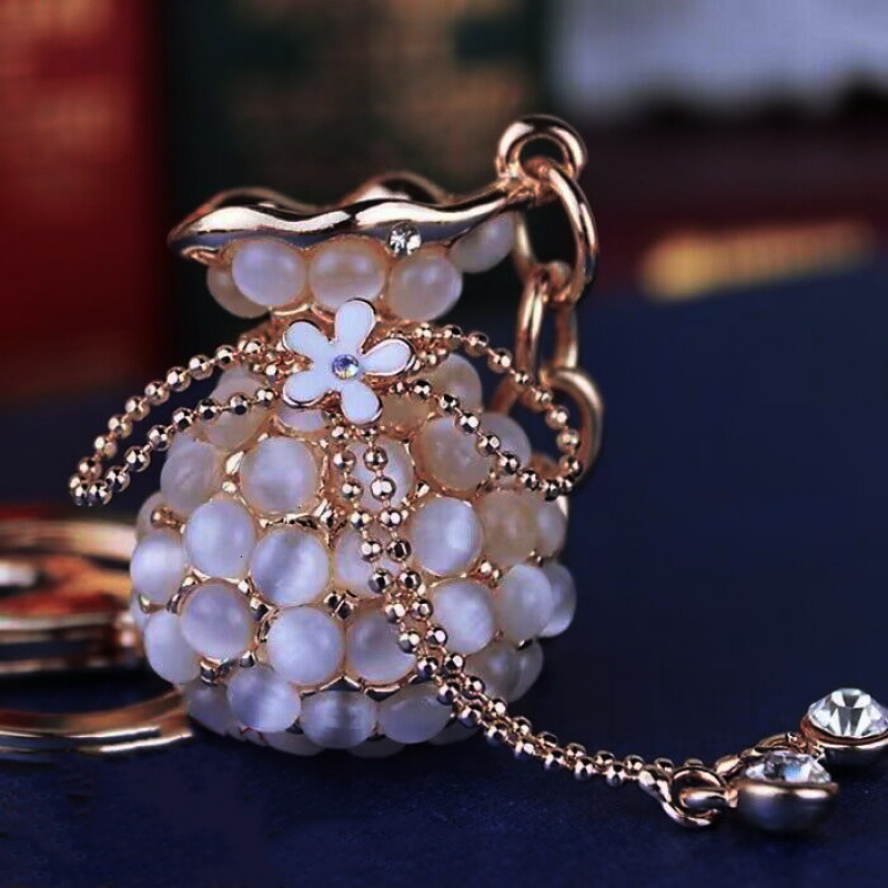 Money Bag Cat's Eye Stone Tassel Rhinestone Version Korean Women's Creative Crystal Car Keychain Key Ring Hanging Car accessories