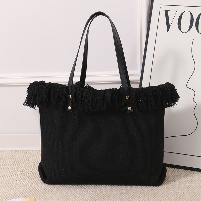 Summer new women's shoulder bag, new tassel handbag, large capacity simple handheld shoulder canvas bag, commuting woven beach bag, new women