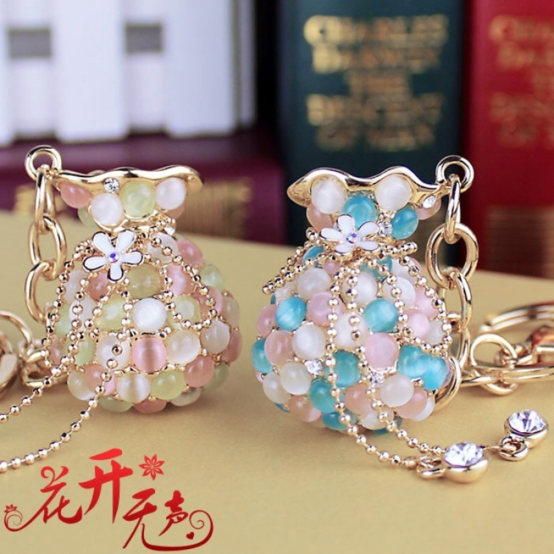 Money Bag Cat's Eye Stone Tassel Rhinestone Version Korean Women's Creative Crystal Car Keychain Key Ring Hanging Car accessories
