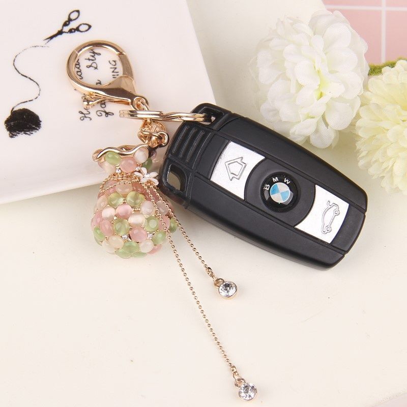 Money Bag Cat's Eye Stone Tassel Rhinestone Version Korean Women's Creative Crystal Car Keychain Key Ring Hanging Car accessories